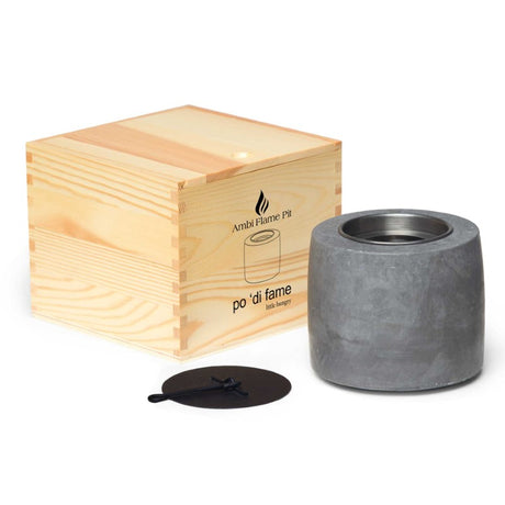 Ambi Flame Pit: elegant cement flame pit with removable canisters, sleek design, and packaged in a natural wood box.
