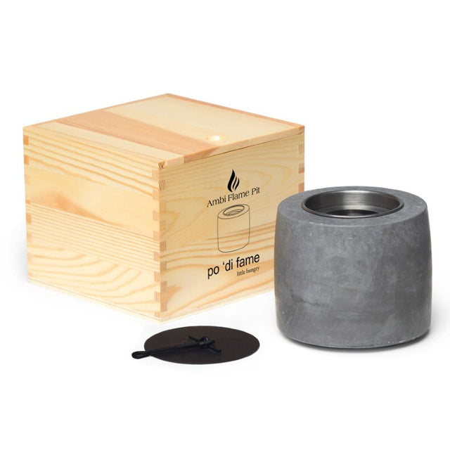 Ambi Flame Pit: elegant cement flame pit with removable canisters, sleek design, and packaged in a natural wood box.