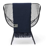 Soft 100% Merino wool blanket throw with herringbone weave, fringes, and luxurious feel, ideal for cozy living spaces.