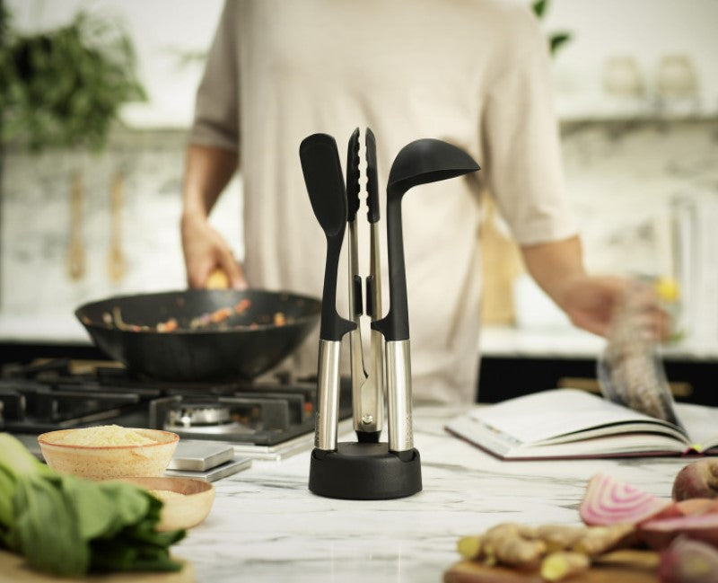 Joseph Joseph Elevate Fusion 3-piece silicone utensil set with stand, featuring heat-resistant tools and sleek stainless-steel design.