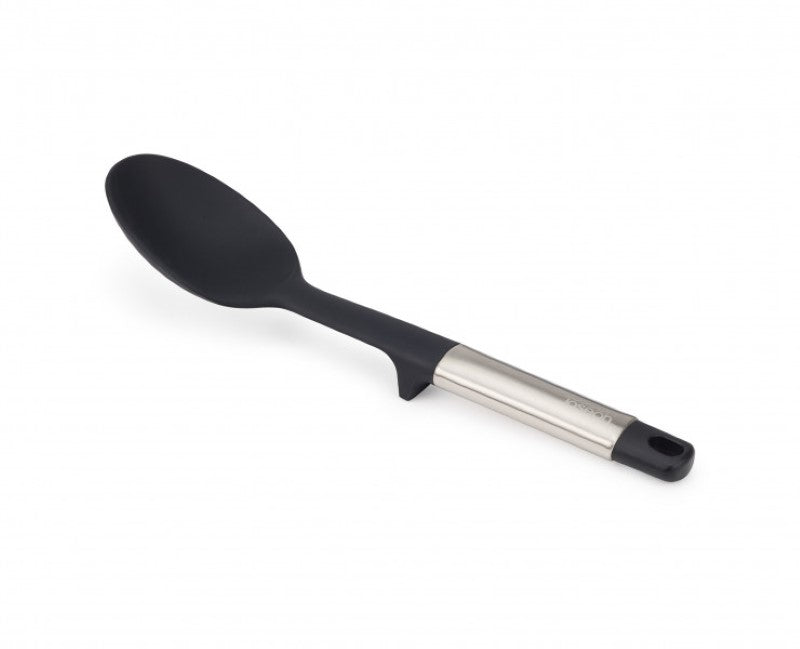 Joseph Joseph Elevate Silicone Solid Spoon with heat-resistant head, stainless-steel handle, and integrated tool rest for mess-free cooking.