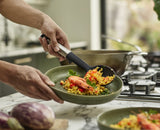 Joseph Joseph Elevate Silicone Solid Spoon with heat-resistant head, stainless-steel handle, and integrated tool rest for mess-free cooking.