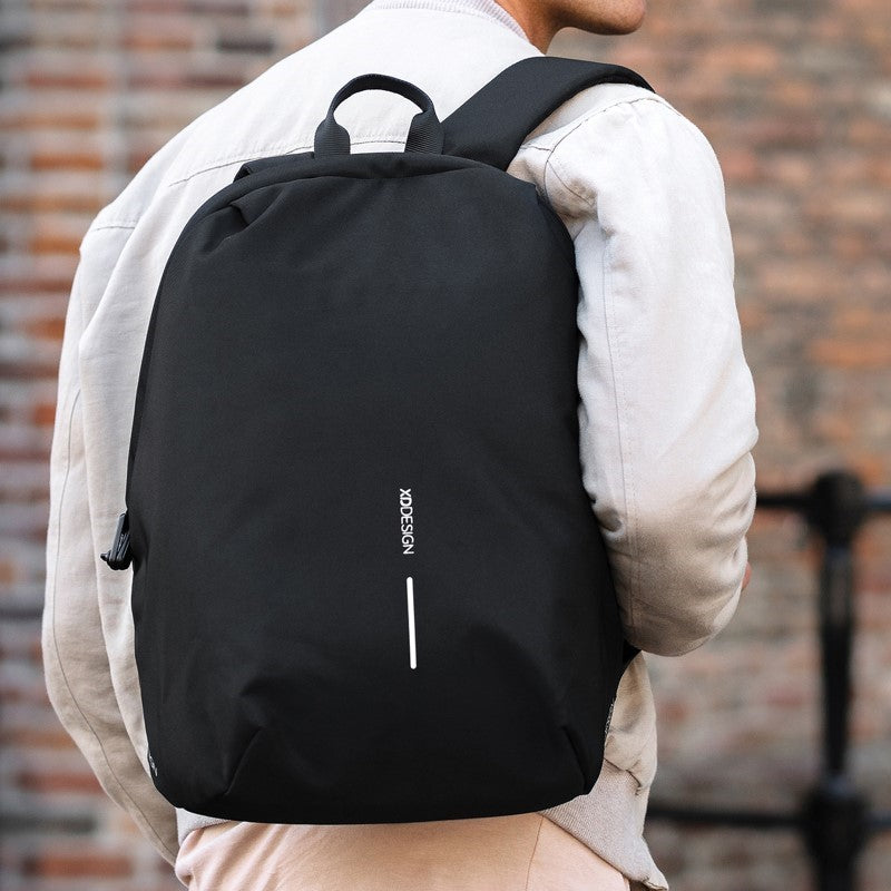 Sleek black Bobby 24L backpack with anti-theft design, padded laptop sleeve, USB port, and eco-friendly materials.