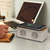 Natural wireless speaker charger made from sustainable materials, featuring 5W audio, Bluetooth V5.0, and eco-friendly design.