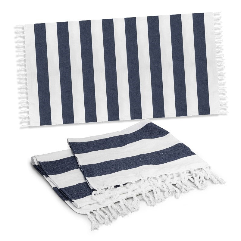 Cotton Towel - Okana in navy, featuring rustic stripes, fringed trim, and made from 100% cotton for beach or poolside use.