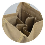 Four bottle jute wine carrier in natural color, featuring padded handles and protective insert, perfect for eco-friendly transport.