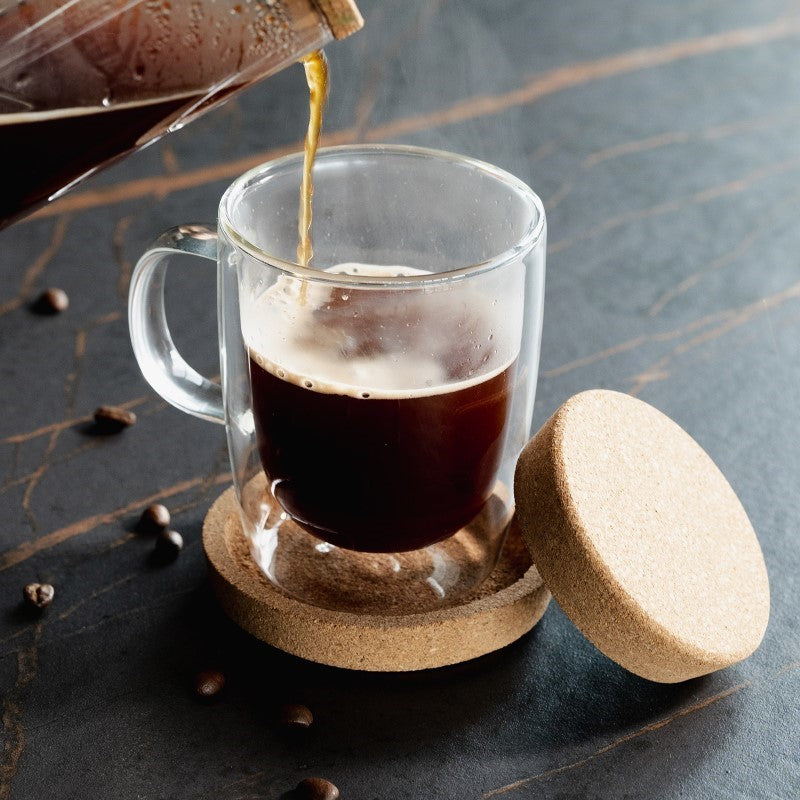 Double-wall borosilicate glass coffee cup with cork lid coaster, beautifully packaged for coffee lovers.