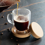 Double-wall borosilicate glass coffee cup with cork lid coaster, beautifully packaged for coffee lovers.