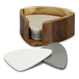 Coaster set mimicking river stones, featuring six ceramic coasters in neutral grey/taupe with an Acacia wood holder.