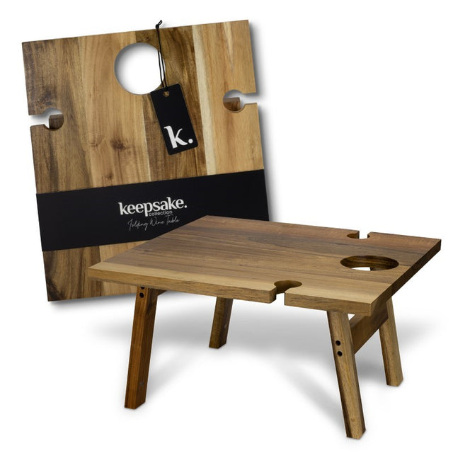 Folding wine table in natural Acacia wood with glass and bottle holders, ideal for outdoor gatherings and elegant events.
