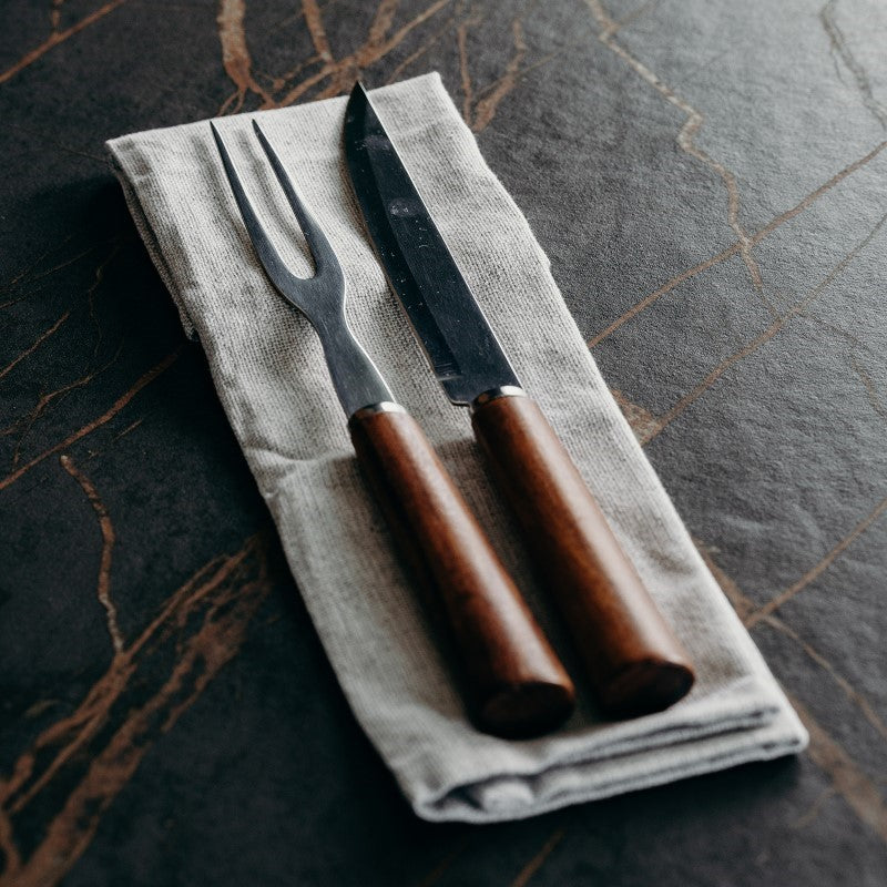 Elegant carving set with Acacia wooden handles and stainless steel blade, presented in a natural gift box.