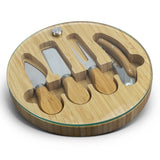 Elegant NATURA Glass Bamboo Cheese Board with natural bamboo base, tempered glass surface, and essential utensils, perfect for entertaining.