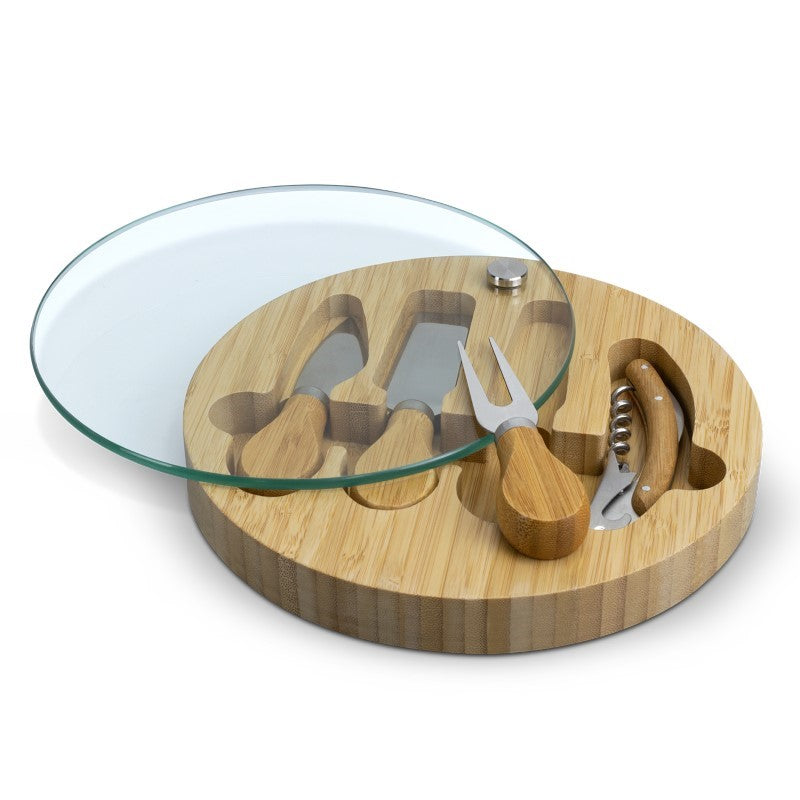 Elegant bamboo cheese board with tempered glass surface and included utensils, perfect for entertaining and gifting.