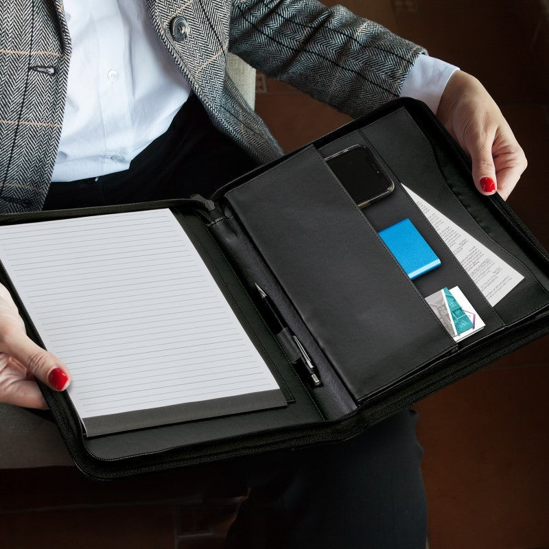 A4 Leather Portfolio in Black with zip closure, curved design, and multiple pockets for documents, phone, and essentials.
