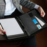 A4 Leather Portfolio in Black with zip closure, curved design, and multiple pockets for documents, phone, and essentials.