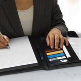 Sleek black A4 portfolio with metal closure, lined pad, and multiple pockets for organized storage and professional presentations.