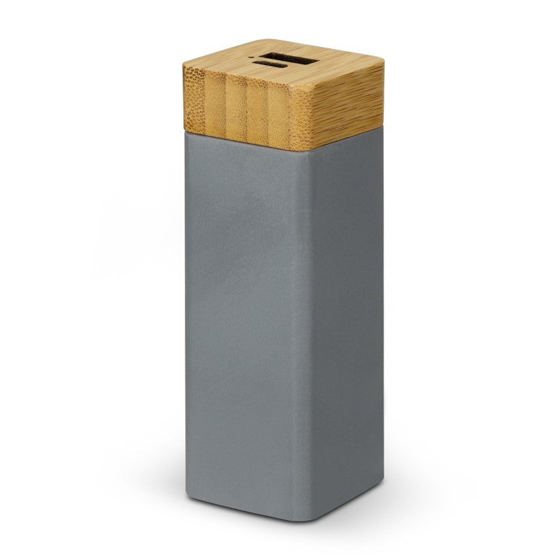 Eco-friendly power bank in charcoal with bamboo trim, 1200mAh capacity, LED indicator, and quick recharge in 4 hours.