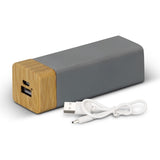 Eco-friendly power bank made of limestone and bamboo, 1200mAh, sleek charcoal design with LED indicator and fast charging.