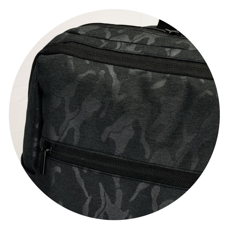 Urban Camo 21L Backpack in Black, featuring durable polyester, spacious pockets, and adjustable straps for comfort.