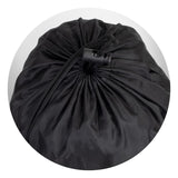 Cozy black puffer blanket with water-resistant fabric, plush foam fill, and drawstring pouch for easy transport and outdoor use.