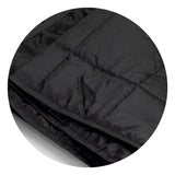 Cozy black puffer blanket with water-resistant fabric, lightweight foam filling, and drawstring pouch for easy transport.