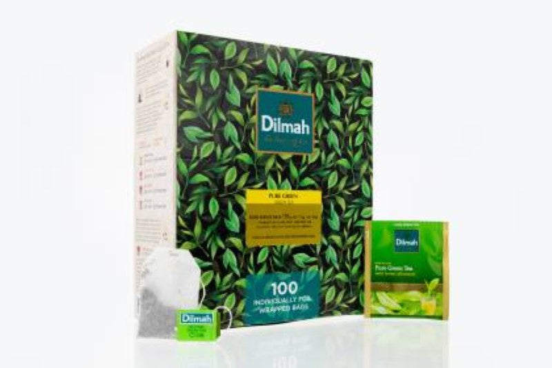 Dilmah Green Tea Bags in foil envelopes, 100 individually wrapped bags for fresh, mild, and smoky herbal flavor.