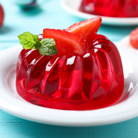 Strawberry-flavored Jelly Crystals in a 2KG pack, perfect for making desserts at home with quality ingredients.