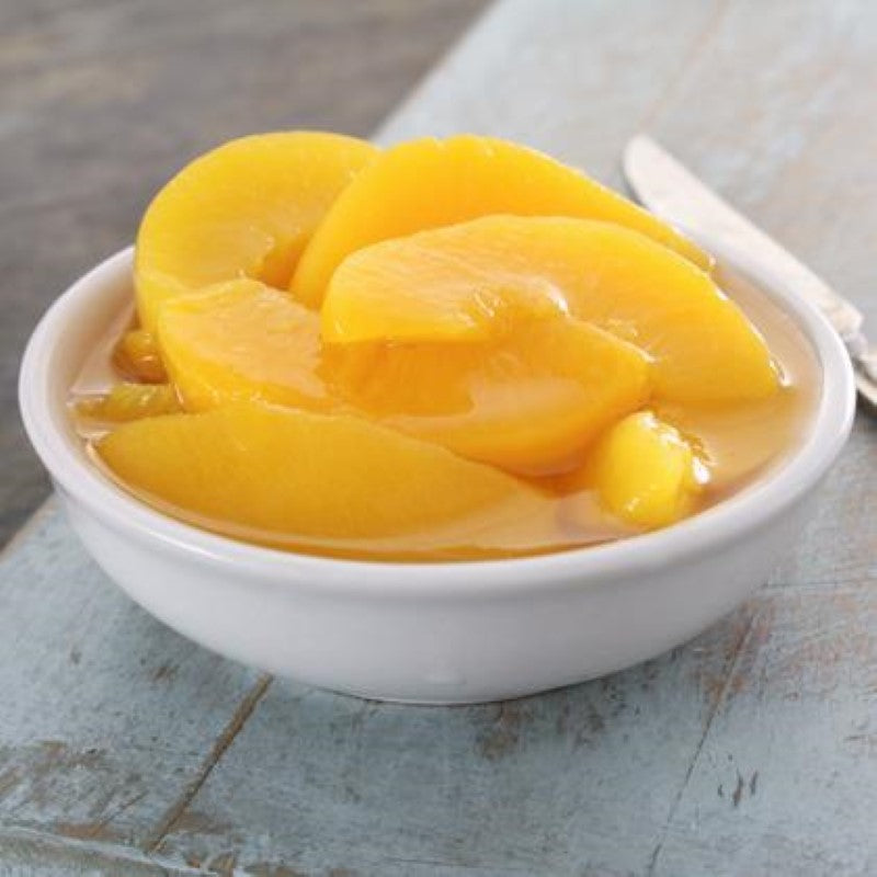 Canned peach slices in lite syrup by Dewfresh, 425g, perfect for snacking or enhancing recipes with fruit flavor.