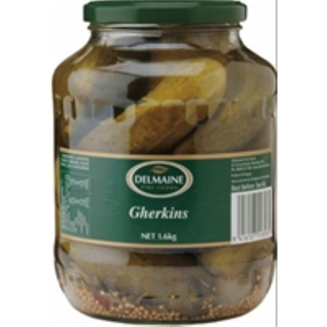 Delmaine Gherkins Whole 1340g jar featuring crunchy pickles infused with mustard seeds for zesty flavor and snacking.