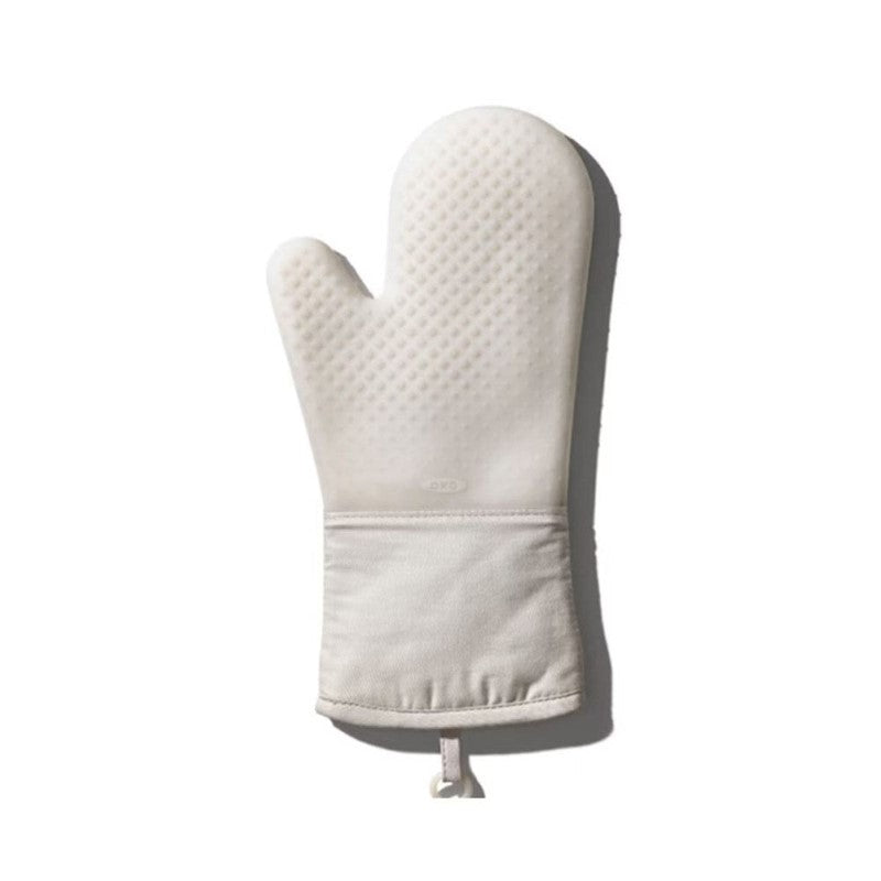 Stylish oat silicone oven mitt with 13-inch length, non-slip grip, and comfortable lining for safe handling of hot items.