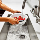 BPA-free OXO Good Grips Colander with non-slip handles, perfect for draining pasta and rinsing fruits and vegetables.