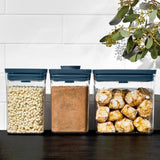 Three-piece OXO Good Grips POP 2.0 Container Set in Storm Blue with airtight lids and nesting design for efficient kitchen storage.