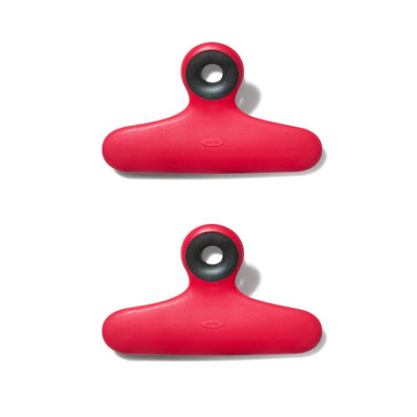 Sturdy OXO Good Grips Bag Clips (2 Pack) with non-slip grip, ideal for sealing snacks and hands-free reading.