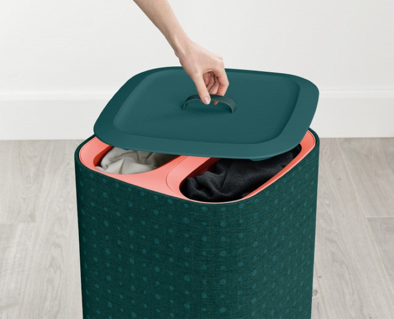 Joseph Joseph Tota Pop 60L laundry basket in green with three removable tote bags for easy fabric separation and transport.