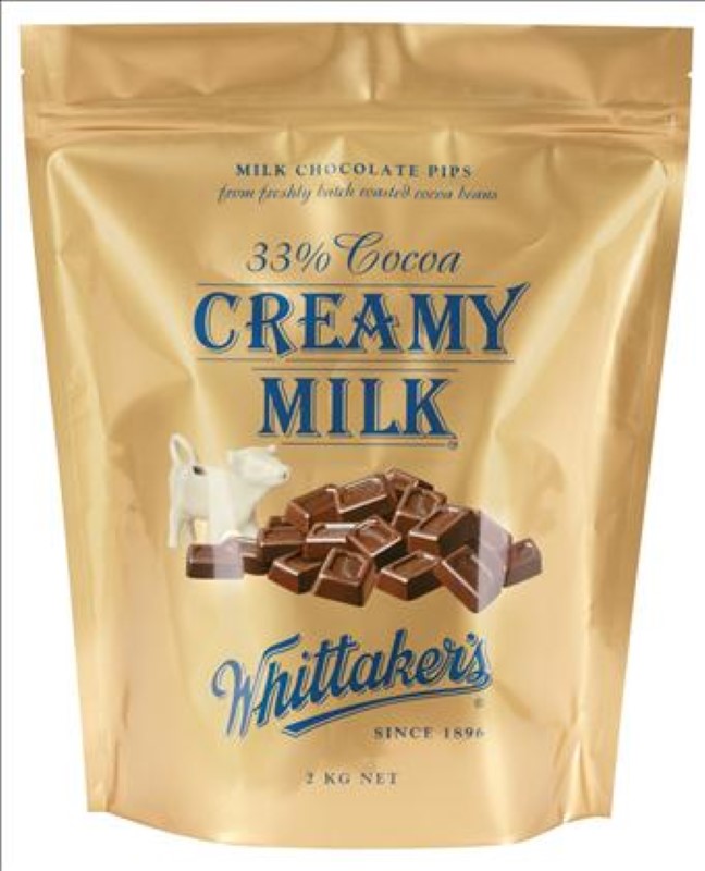 Rich 2KG pack of Whittaker's Creamy Milk 33% Chocolate Pips, perfect for baking and snacking, made in New Zealand.