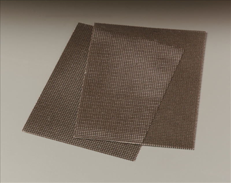 Heavy-duty Scotch-Brite griddle screens for efficient cleaning of grease and food build-up, 20 pieces for commercial and home use.