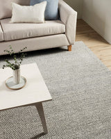 Handwoven 250x350cm beige rug with knotted weave, made of wool, cotton, and polyester, perfect for enhancing home decor.