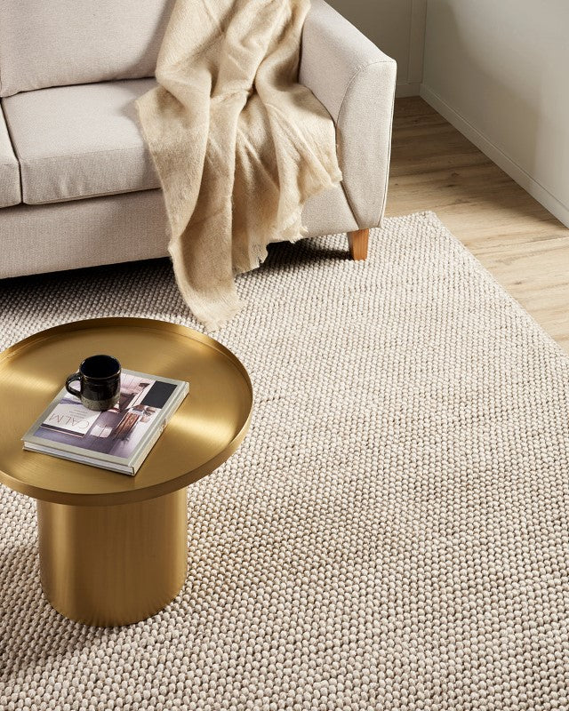 Cyrus Earth 250x350cm handwoven floor rug in warm beige, featuring a textured knotted weave for comfort and style.