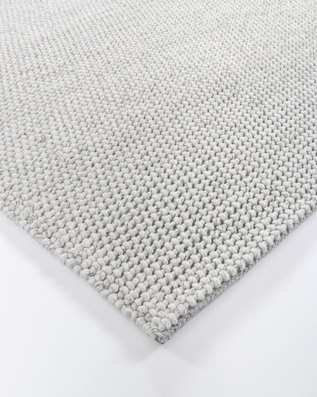 Cyrus Silver 250x350cm floor rug in luxurious silver, perfect for adding elegance and comfort to modern home spaces.