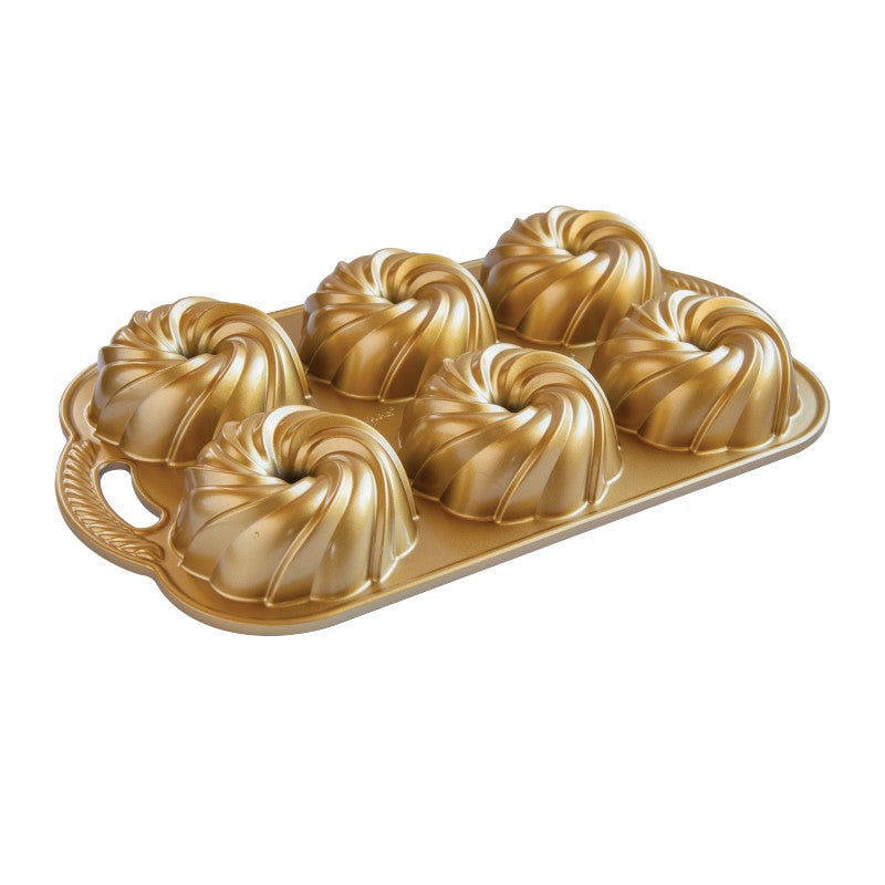 Elegant Bundtiette Pan with swirl design for perfect mini bundt cakes, crafted from durable cast aluminum for superior baking.