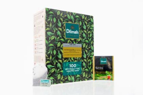 Dilmah Earl Grey tea bags in foil envelopes, delivering floral and citrus flavors with 100 individual packs for freshness.