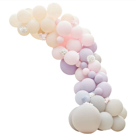 Luxe balloon arch with pink, lilac, and grey balloons, complemented by hydrangeas for elegant celebrations.