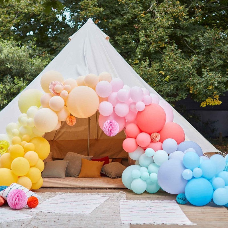 Luxe Bright Balloon Arch kit with 200 balloons and paper honeycombs, perfect for vibrant party backdrops and celebrations.