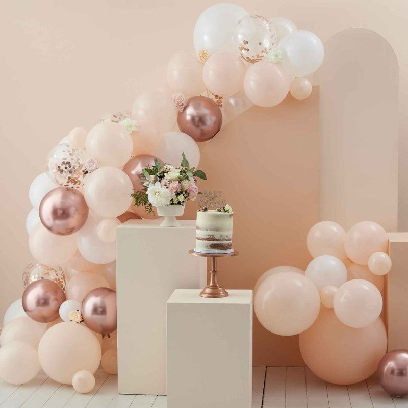 Elegant peach, white, and rose gold balloon arch kit with 70 balloons, perfect for baby showers and celebrations.