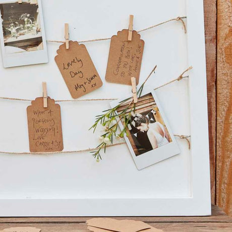 Rustic guest book frame featuring pegs and twine, perfect for collecting heartfelt messages at special events.