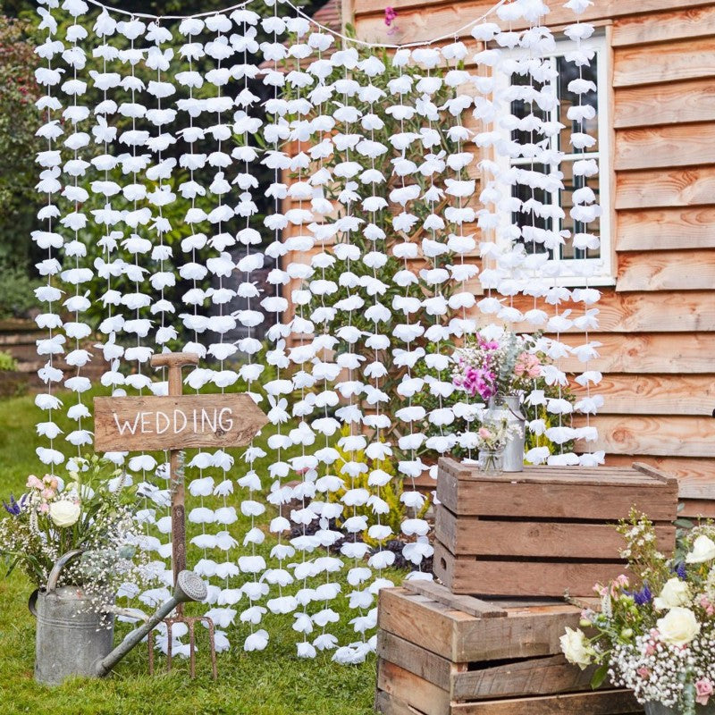 Rustic floral photobooth backdrop featuring white artificial flowers, perfect for events measuring 2m W x 1.8m H.