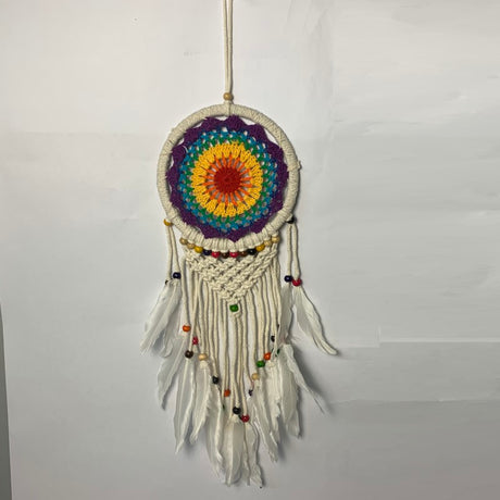 Vibrant 17cm crochet dreamcatcher, beautifully handmade for boho decor and protection against bad dreams.