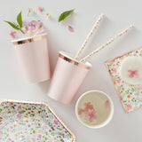 Ditsy floral paper cups with rose gold polka dots, perfect for stylish celebrations, pack of 8, 9.5cm height, 7.5cm width.