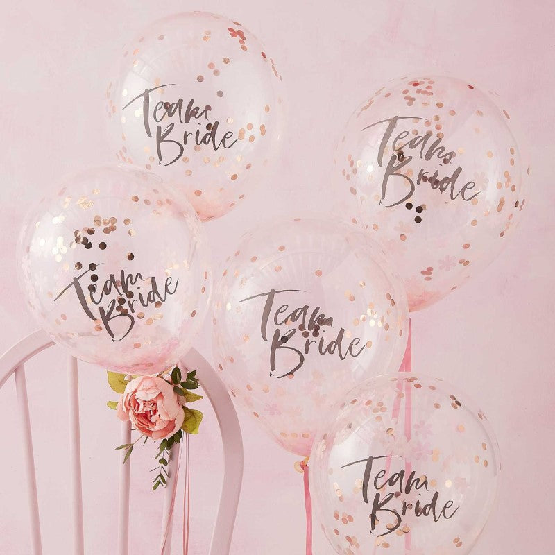 Floral hen party balloons with pink and rose gold confetti, perfect for Team Bride celebrations. Pack of 5, 30cm each.