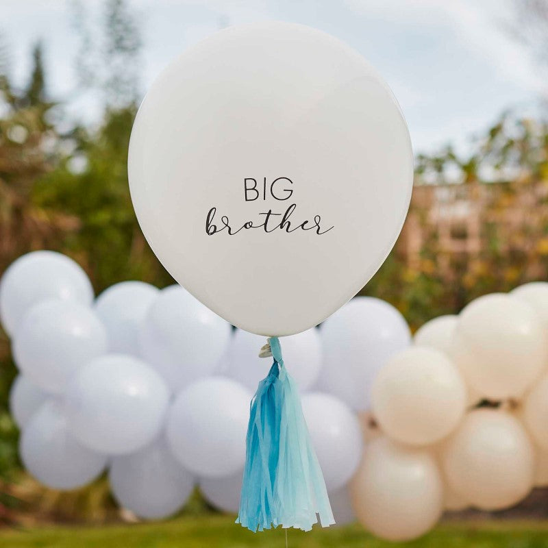 White 18" latex balloon with 'Big Brother' printed on both sides, featuring blue tassels for festive celebrations.